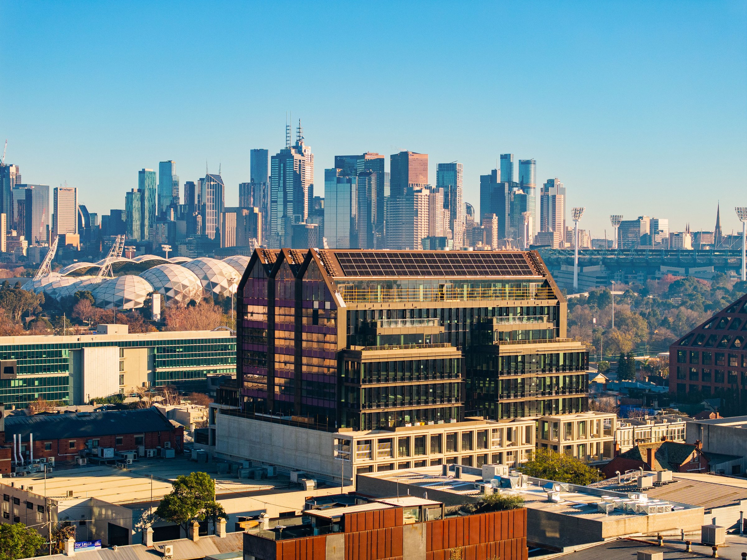 Cremorne Place office building in Cremorne with the Melbourne CBD skyline behind
